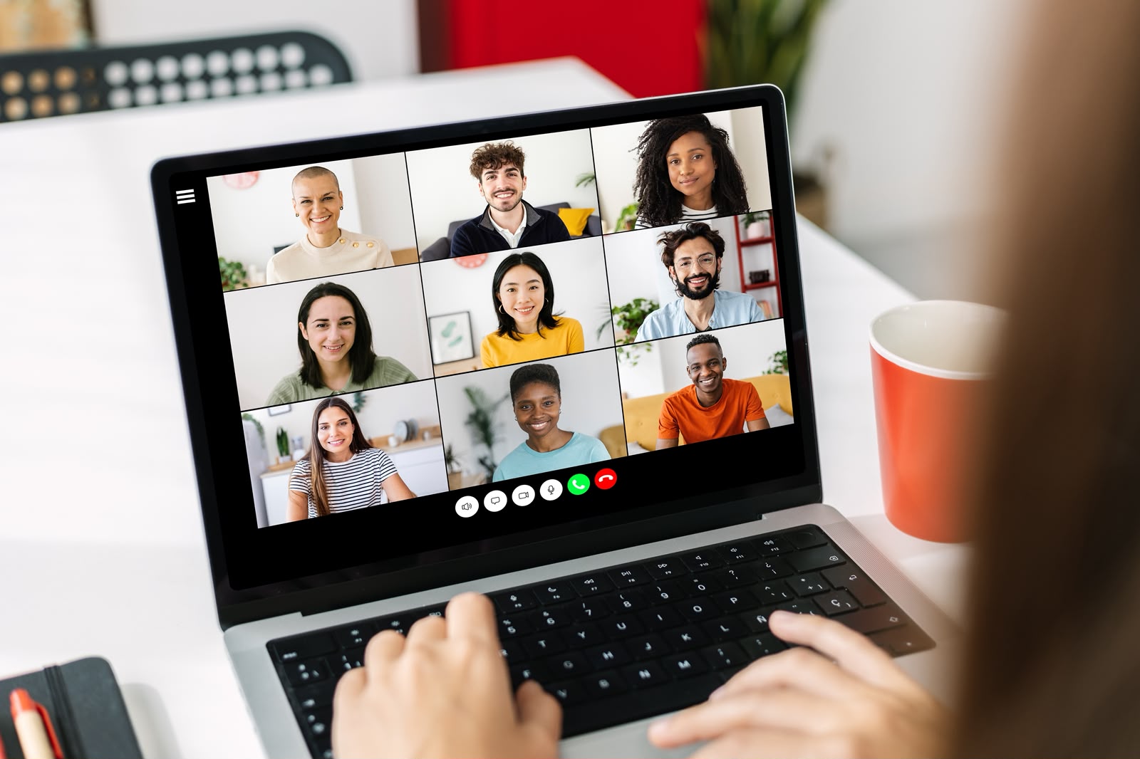 Professional participating in a remote video conference on a laptop
