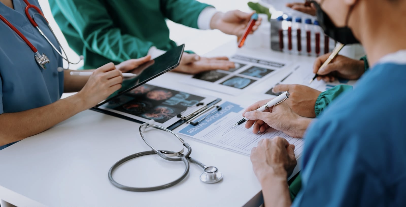 Healthcare professionals reviewing medical records and diagnostics together