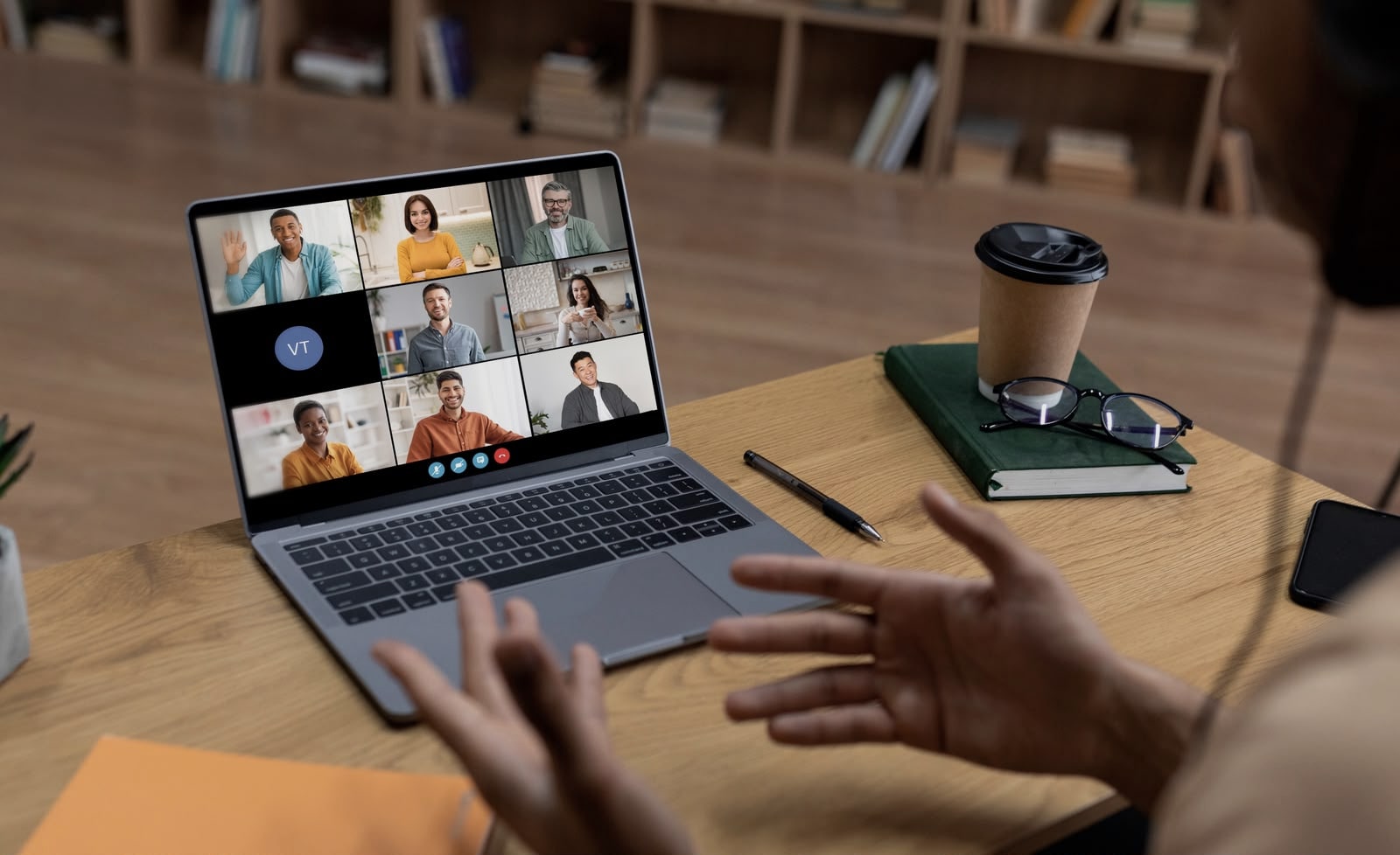 Remote team collaborating over a video call from a home office