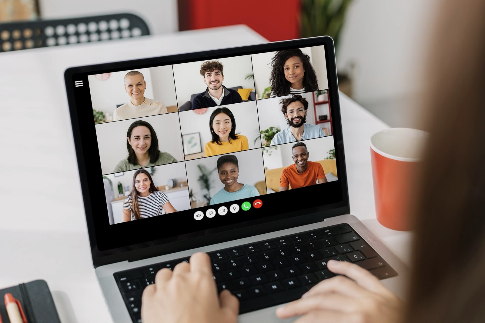 Professional participating in a video conference call on a laptop