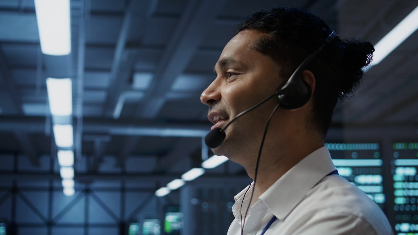 Technical support specialist wearing a headset in a professional environment